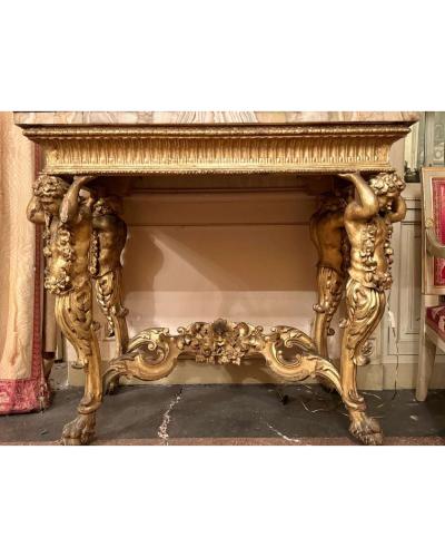 Two Console Tables, first quarter of the 18th century Carved giltwood and marble